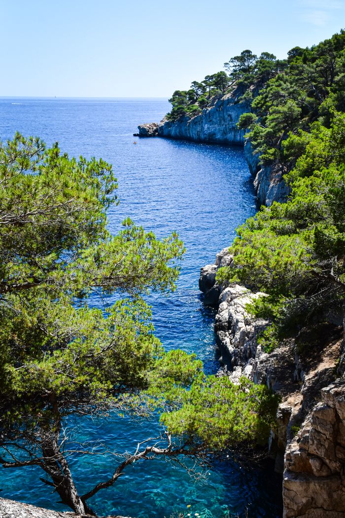 Breathtaking view of rocky coastline and blue sea in Provence, showcasing natural beauty.